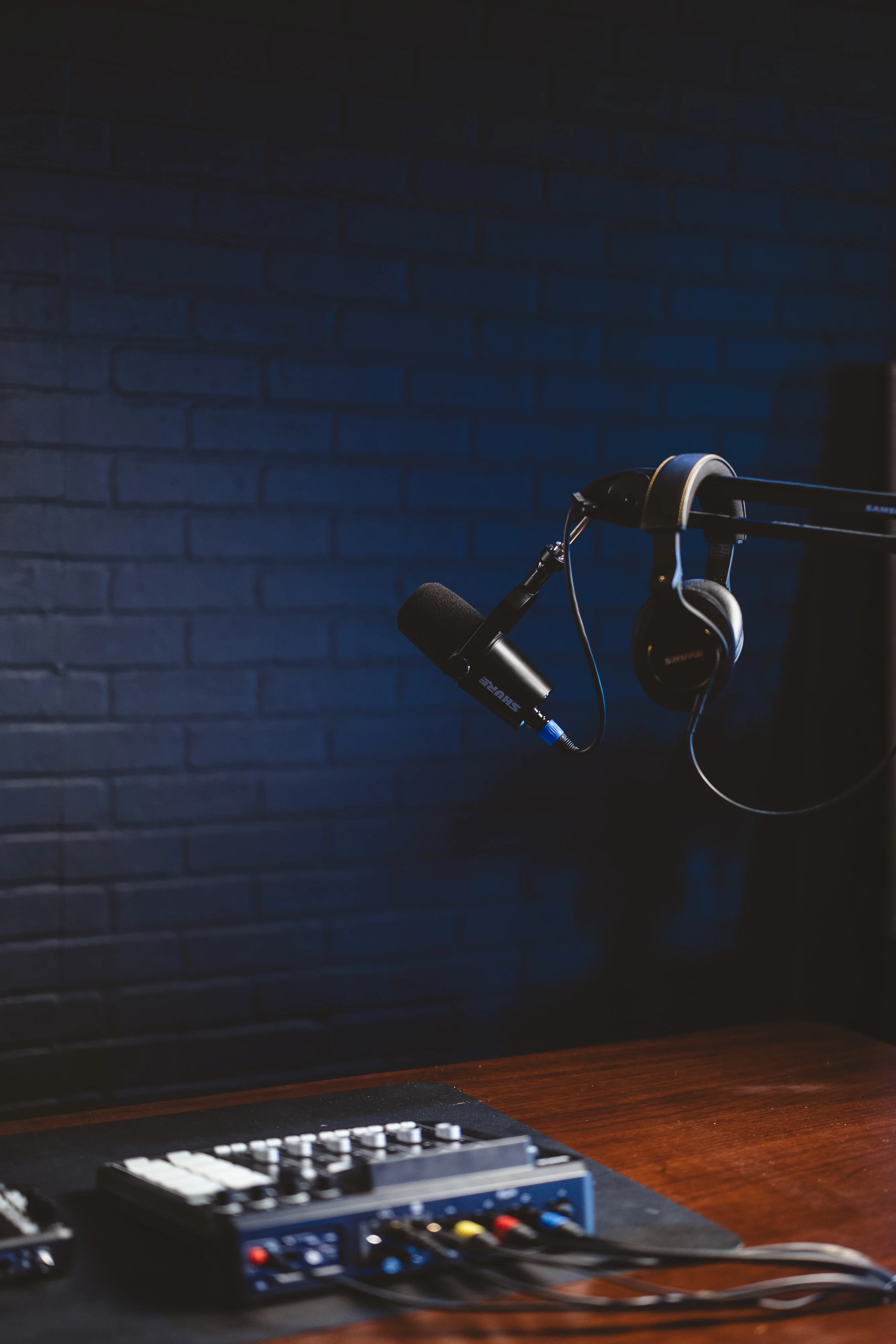 Podcast microphone on a boom arm with headphones