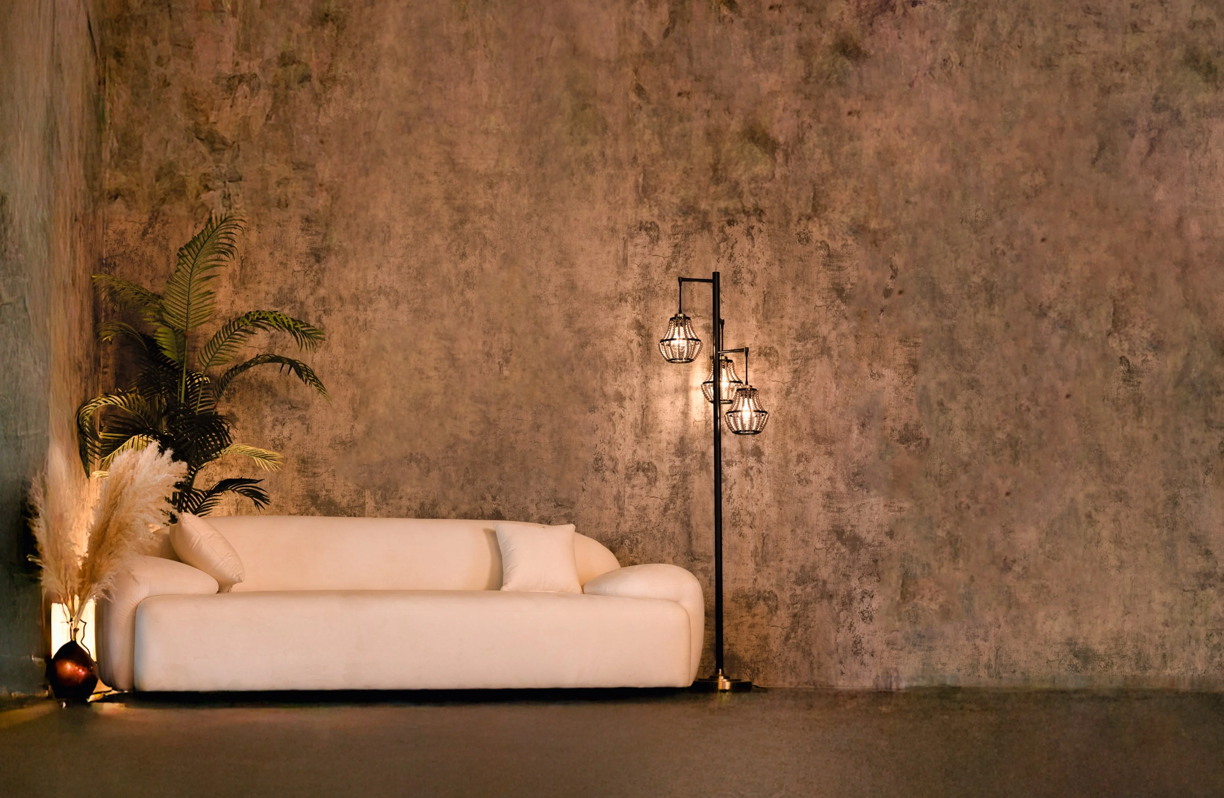Cream sofa against a textured plaster wall