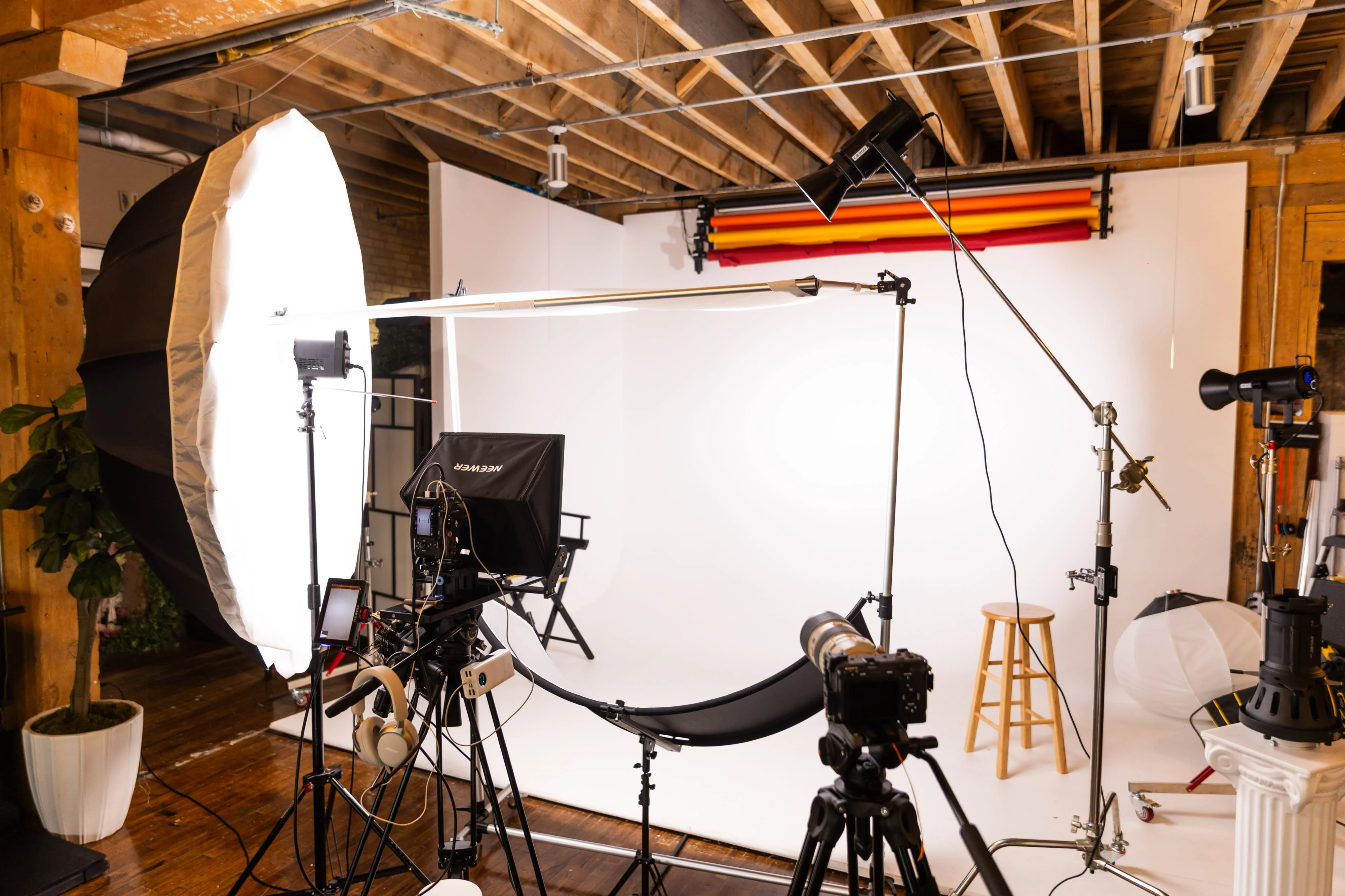 White seamless backdrop with an octabox and boom arm
